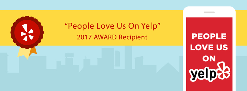 Banner showing the "People Love Us On Yelp" 2017 Award with a red ribbon and a phone displaying the Yelp logo against a cityscape background.